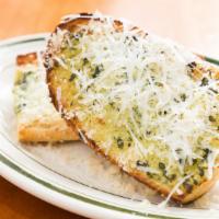 Garlic Bread With Basil Butter & Parmesan · Top menu item. Wuthrich butter, Genovese basil, garlic confit, fresh garlic, and Parmesan.