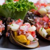 Choros A La Chalaca (12)* · Mussels topped with a juicy lime marinate of onions, tomatoes and corn. / Mejillones rematad...