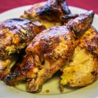 Pollo A La Brasa Entero · Tumi's famous juicy family style rotisserie chicken with no sides. / El famoso pollo a la br...