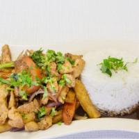 Pollo Saltado · Peruvian-style chicken stir-fried sautéed with onions, tomato, French fries and our mind-blo...