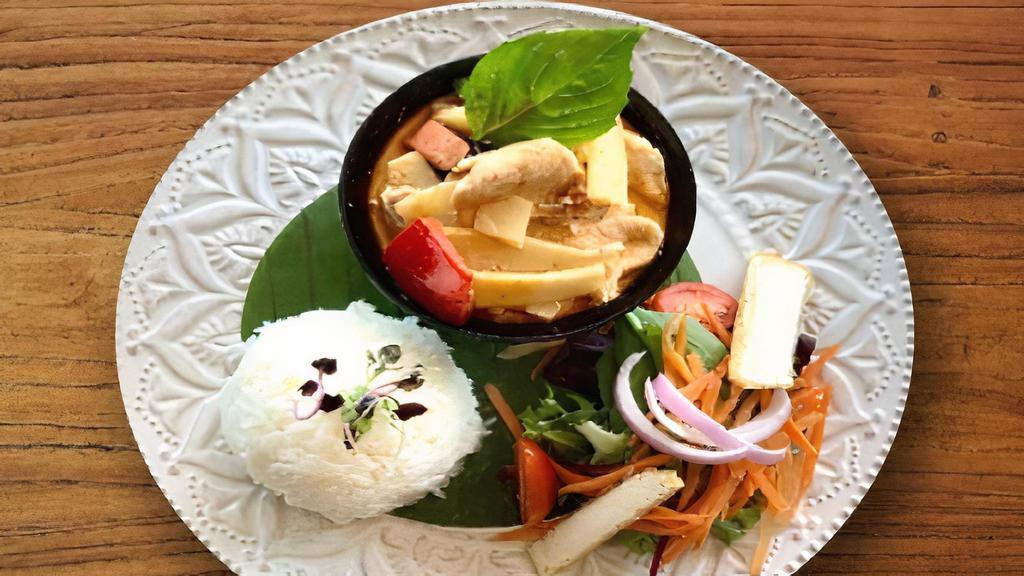 Lunch Red Curry · Red curry paste with bamboo shoot, eggplant, curry carrot bell pepper and basil in coconut milk.