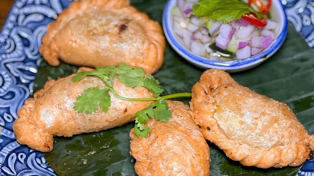 Curry Puff · Minced chicken, potato, mixed peas & carrot, onion in puff pastry with cucumber vinaigrette dip.