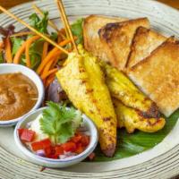 Chicken Satay · Grilled marinated chicken tenders on skewers. Served with toasted bread, peanut sauce, cucum...
