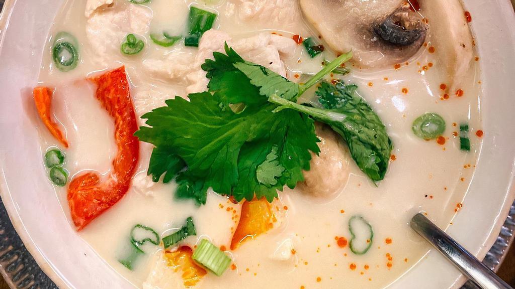 Tom Kha · Gluten-free. (Choice of chicken or vegetables) Aromatic herbs, mildly spiced, coconut milk soup, mushroom, bell pepper, scallion, cilantro, onion.