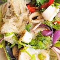 Yum Woon Sen · Gluten-free, spicy. Mixed Seafood, glass noodles, red onions, tomato, cilantro, chili, scall...