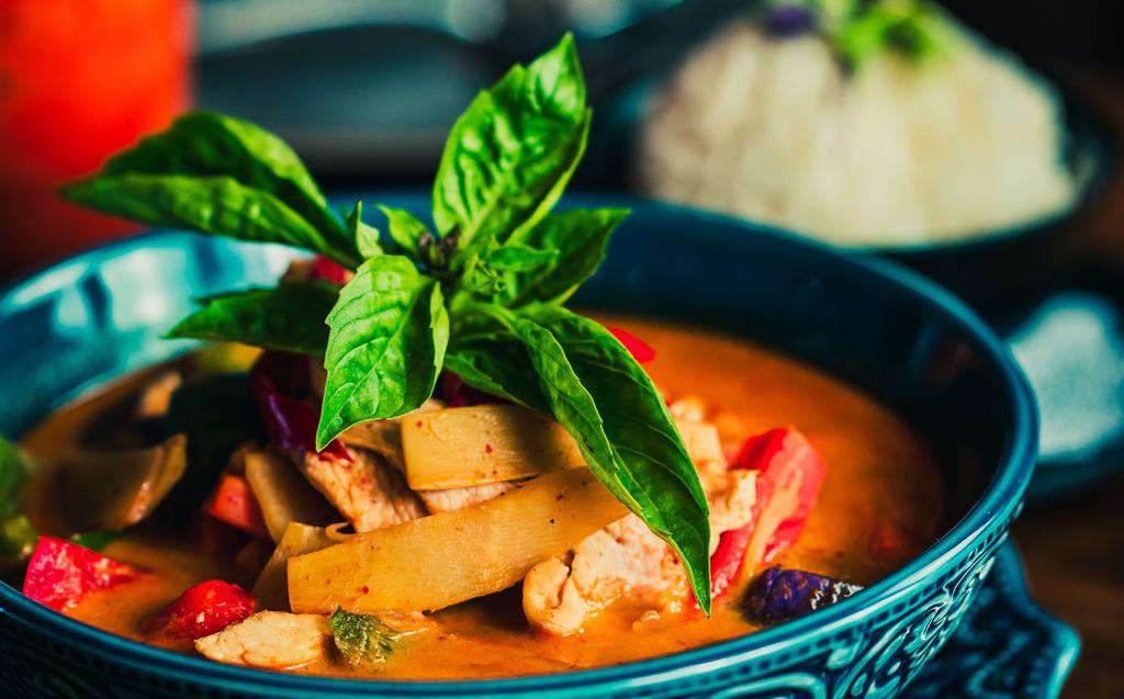 Red Curry · Spicy. Red curry paste, bamboo shoot, eggplant, carrot, bell pepper, basil, coconut milk, served with jasmine rice.