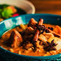 Massaman Curry With Roti · Mild. Sweet curry paste, potato, peanut, onion, fried shallot, coconut milk.