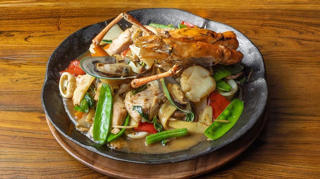 Pad Cha · Spicy. Sautéed mixed seafood w/ white wine, mushroom, long hot pepper, lime leaf, carrot, onion, string beans, Thai herbs in chili basil sauce.
