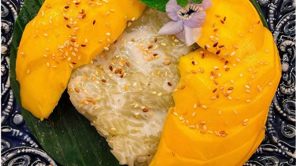 Mango Sticky Rice · Fresh whole mango with pandan infused sticky rice, topped with coconut milk drizzle