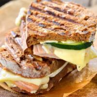 Oven Gold Panini · Fresh Panini made with Turkey, provolone cheese, mix green tomatoes, balsamigrete. Served on...