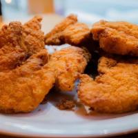 Chicken Tenders (6 Pieces) And One Side · Boneless fried chicken tenders are made with white meat chicken