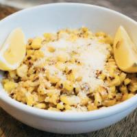 Sauteed Corn With Parmesan · (Oven roasted) olive oil, salt, pepper, a touch of mayo, parmesan on top with a piece of lem...