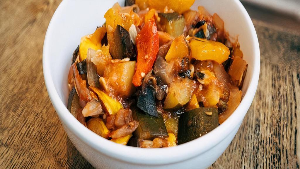 Ratatouille · A classic french dish, Eggplant, zucchini, yellow squash, tomato, onion, red and yellow peppers, cooked in olive oil with parsley, garlic, basil, and thyme.
