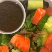 Mixed Greens · Mixed baby lettuce, cucumbers, tomatoes, balsamic vinaigrette