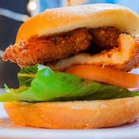 Fried Chicken Sandwich · Breaded and fried chicken breast, romaine lettuce, tomatoes, chipotle mayo sauce on a brioch...