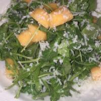 Kale Caesar · Baby kale, romaine blend, house Caesar, crostini, shaved Parmesan.