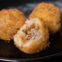 Fried Glam Balls · Fried Buttery Grits stuffed with Ground Turkey Safrito Mix