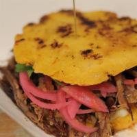 Arepas · Beef, 2 cheese arepas, pickled onion, cilantro.