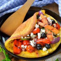 Greek Omelette · Two eggs, feta cheese, tomatoes, and onion.