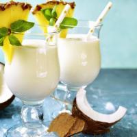 Coconut Shake Smoothies · Fresh coconut water, coconut meat, raw cocoa, and fresh fruit.