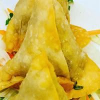 Samosa (Homemade) · Vegetarian. Crispy pastry filled with mildly spiced green peas & minced potatoes.