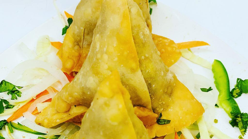 Samosa (Homemade) · Vegetarian. Crispy pastry filled with mildly spiced green peas & minced potatoes.