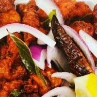 Chicken 65 · Boneless chicken cubes are well marinated in secret spices with yogurt and browned to perfec...