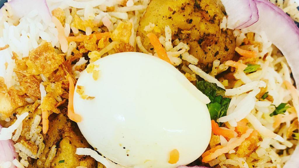 Shrimp Biryani · Saffron Rice layered over slow cooked shrimp with aromatic spices & Special masala.