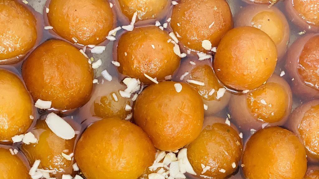 Gulab Jamun · Milk solids made into small balls, deep-fried in oil, & dipped in a sweet.