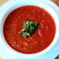 Tomato Herb Soup · Stewed tomatoes pureed with fresh oregano & basil--topped with pistachio basil pesto (vegan,...