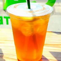Iced Green Tea · House brewed green and black tea served with a slice of lemon.