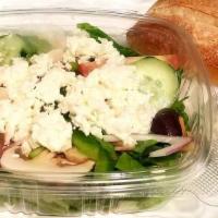 Greek Salad · Romaine lettuce with cucumbers, tomatoes, olives, onions, and feta cheese in the creamy Gree...