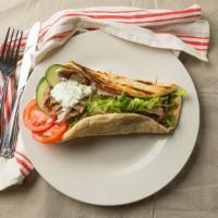 Lamb And Beef Gyro Sandwich · Ground lamb, beef mixed with onion, cumin, black pepper, salt vertically grilled, sliced ver...