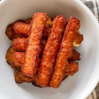 Maduros Con Queso · Sweet plantains with fried cheese.