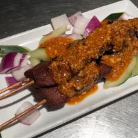 Satay Beef · Spicy. Marinated beef served with peanut sauce.