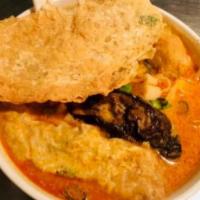 Malaysia Style Curry Stuffed Combination · Spicy. Tofu, eggplants, and dried beancurd filled with fish paste in coconut curry soup.