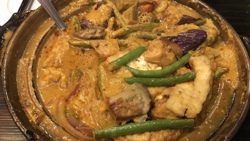 Indian Curry Asam Fish Head Or Stingray Fish Casserole · Spicy. One of signature dish fish with onion, lady finger, string beans, tomato, crispy tofu and eggplant in curry asam sauce.spicy.