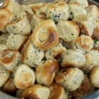 Garlic Knots · Rolled baked garlic bread.