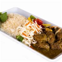 Curried Goat · Succulent morsels of fresh goat seasoned with Jamaican spices and slow-cooked to a tender, d...