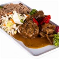 Brown Stew Chicken Rice & Peas · Brown stewed chicken with rice and peas and cabbage and carrot mix.