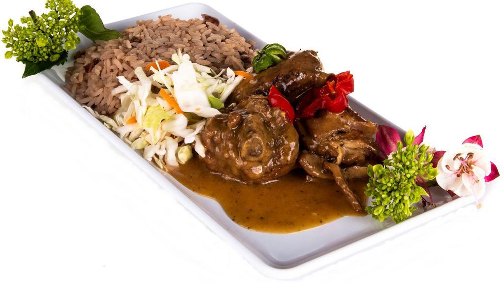 Brown Stew Chicken Rice & Peas · Brown stewed chicken with rice and peas and cabbage and carrot mix.