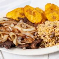 Bistec Encebollado Platillo · Steak Sauteed In onions, Served With Mexican Orange Rice And Refried Beans,  With 4 Corn Tor...