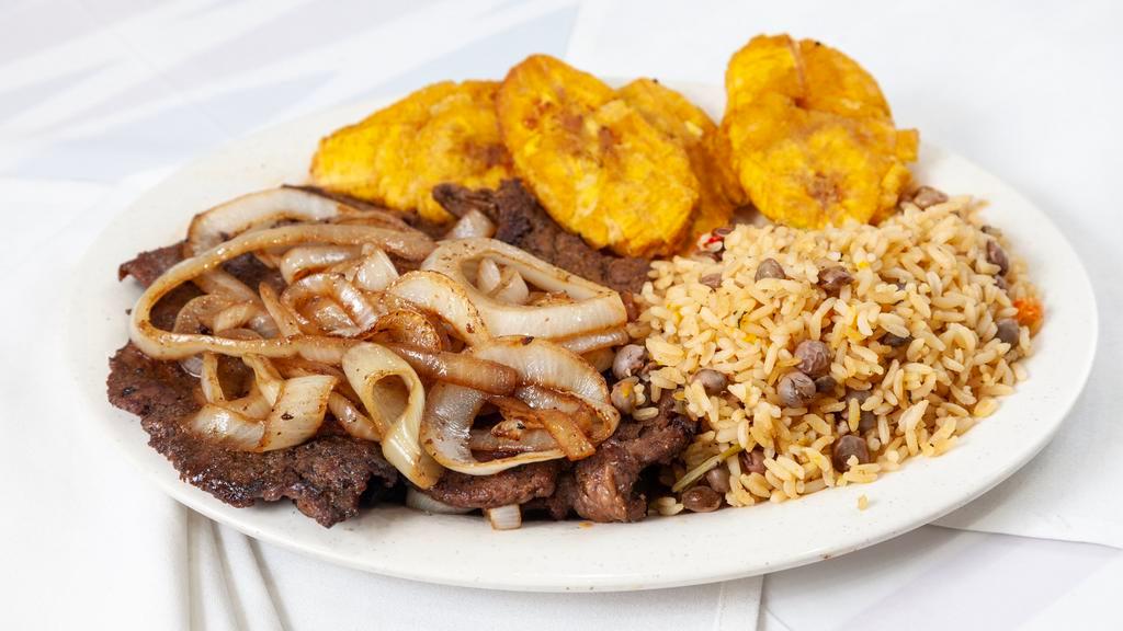 Bistec Encebollado Platillo · Steak Sauteed In onions, Served With Mexican Orange Rice And Refried Beans,  With 4 Corn Tortillas. You Can Substitute For Balck Beans Or Mexican white Rice For Additional Charge