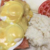 Lox Benedict · Two poached eggs with smoked salmon on an English muffin with cream cheese and sliced grille...