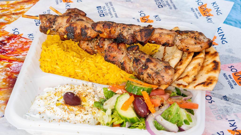 Chicken Souvlaki · Marinated and hand skewered chicken on a stick, grilled over a hardwood charcoal grill.
Served with bread.