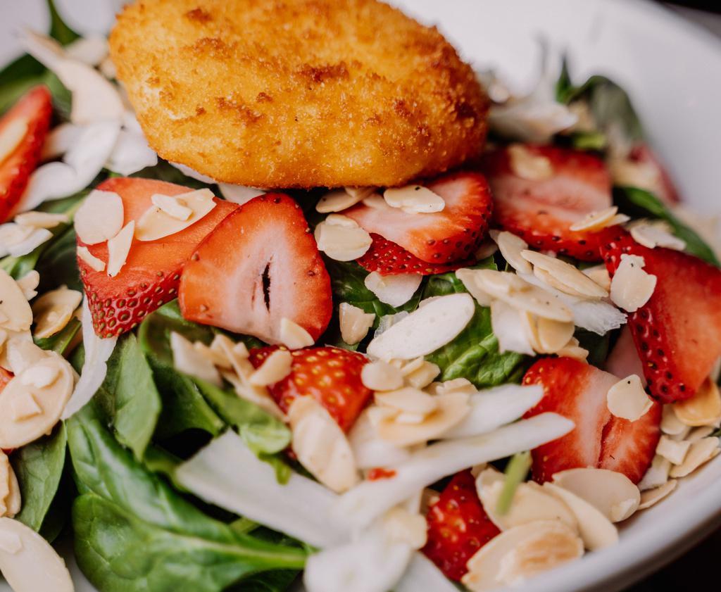 Strawberry And Fried Goat Cheese Salad · Baby spinach, fennel, strawberries, fried goat cheese, champagne vinaigrette, almonds