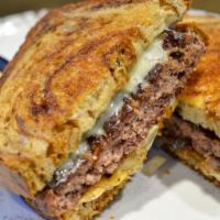 Patty Melt Burger · Served with fried onions and melted american cheese on grilled rye bread served open face.