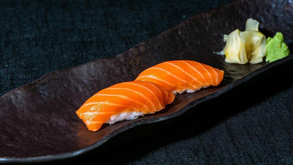 Salmon Sushi · Two Sashimi sliced Salmon served on top of sushi rice