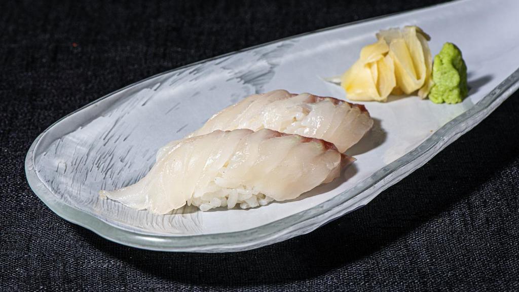 Sea Bream Sushi · Two sliced Tai Snapper served on top of sushi rice