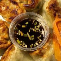 Fried Veggie Gyoza · Deep-fried dumplings filled with cabbage and napa cabbage.
